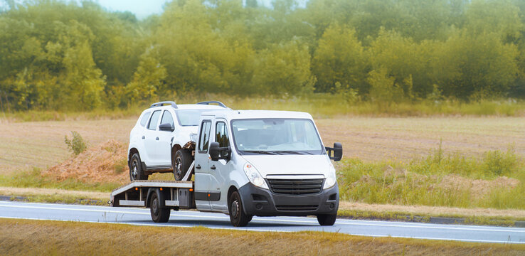 Wrecked car transported by professional recovery service