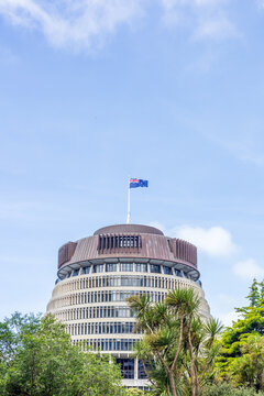 A striking view of the Beehive, the executive wing of New Zealand&rsquo;s Parliament Buildings, surrounded by greenery in Wellington