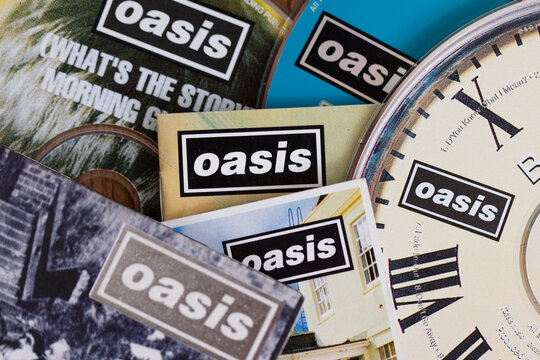 London, UK - August 27 2024: Oasis band cds. Oasis are a popular rock band from the 1990's britpop era