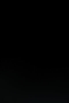 Minimalist solid black background with a very subtle dark grey texture, providing a clean and elegant deep aesthetic space for high-end product photography, luxury branding, and sleek web design.