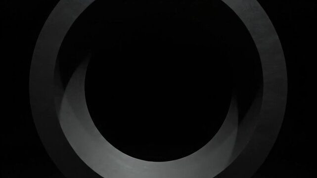A dark surreal scene with a metallic ring on a reflective surface in darkness.