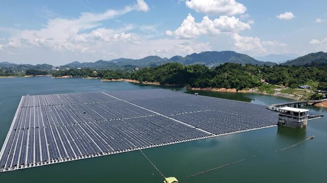 Large-scale solar panel array floating on a lake, generating renewable energy in a scenic environment.