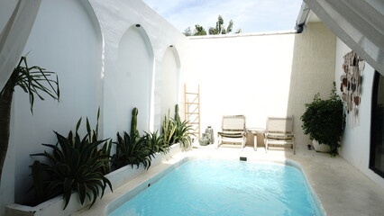 summer vacation photos at a villa with a private pool and lounge chairs