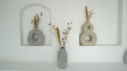 Photo of aesthetic decorative display of fake ornamental plant pots