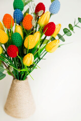 The breeze of spring. Easter composition with tulips and crocheted eggs. Featuring bouquets with handmade accents.

