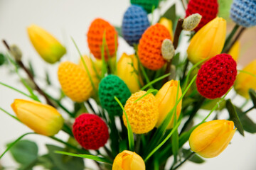 The breeze of spring. Easter composition with tulips and crocheted eggs. Featuring bouquets with handmade accents.

