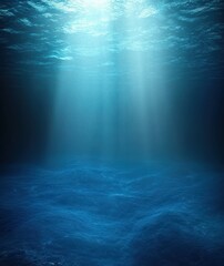 Obraz premium deep blue underwater seascape with sunlight beams piercing the water to a serene textured seabed, calm and mysterious atmosphere