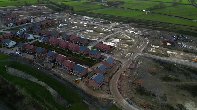 Housing development builds progress over time in Ripon with vibrant red-brick homes and dynamic construction activity