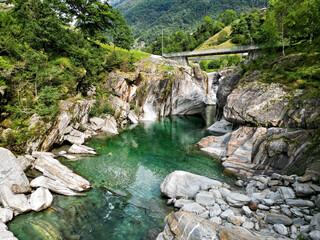 Mountain landscape with a stream in the Verzasca Valley in the Swiss canton of Ticino in late summer