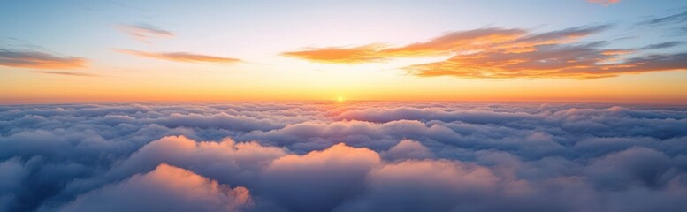 aerial sunrise above a sea of soft fluffy clouds with a golden horizon and tranquil pastel sky conveying peaceful calm