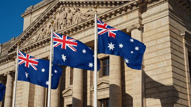 Australian flags waving in front of a classical building