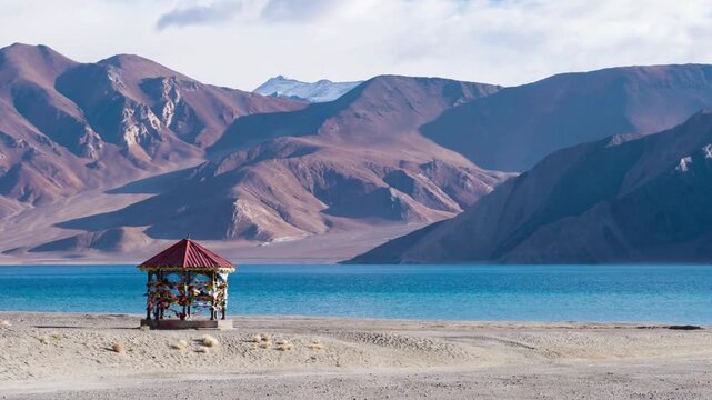 Scenic View of Pangong Tso Lake with Mountains and Gazebo in Ladakh, India