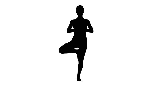 Silhouette of a person in yoga pose.