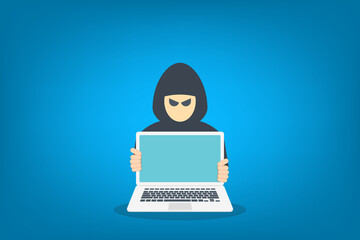 hacker in front of his computer committing digital cybercrime