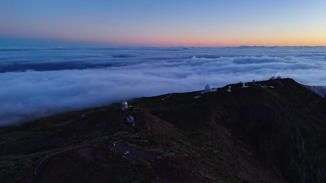 Aerial drone footage of telescopes at sunrise in Roque de los Muchachos, La Palma