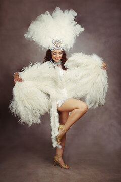 Dynamic Cabaret Showgirl in White Feather Costume