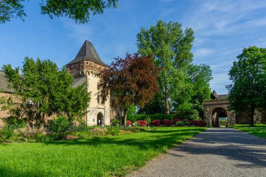 Medieval Architecture of Schloss Friedestrom in Zons Germany with Scenic Green Landscape