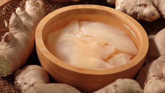 Pickled ginger in a wooden bowl.