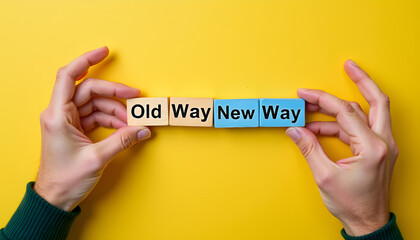 Old way versus new way concept with wooden blocks in human hands, business change and transition idea
