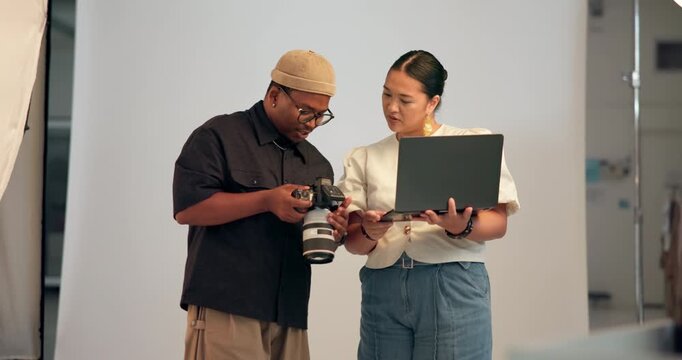 People, photographer and camera with laptop for photoshoot, review pictures and filming catalog. Team, talk and equipment with photography selection, feedback and editing advice for fashion magazine