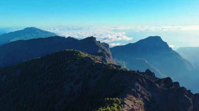 Aerial drone footage revealing sun rays inside caldera at Roque de los Muchachos, La Palma