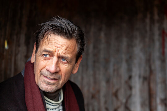Thoughtful senior man contemplating outdoors