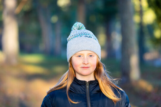Portrait of long haired girl in knit hat