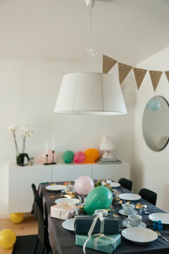 View of dining table with birthday setup at home