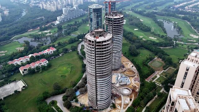 Sun Court, Jaypee Greens captured from above&mdash;elegant residential towers, landscaped fairways, and premium living framed by NCR&rsquo;s distant haze.