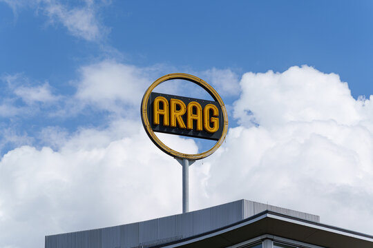 ARAG insurance company logo on pole sign above commercial building rooftop