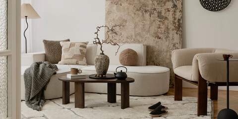 Neutral tone interior design with modern furniture and cozy accessories