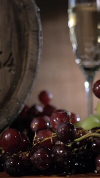 Slow Motion, Deep Red Grapes Spill Over Next To Timeworn Barrel In Cozy Cellar Environment Filled