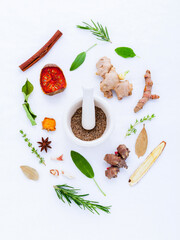 Assortment of Fresh Herbs and Spices with Mortar and Pestle