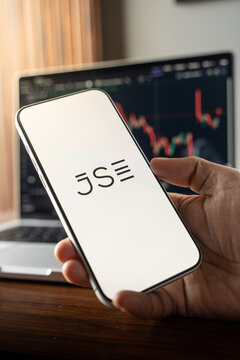 JSE or Johannesburg Stock Exchange logo is displayed on the screen of a smartphone, in Bangalore, India, on February 12, 2026