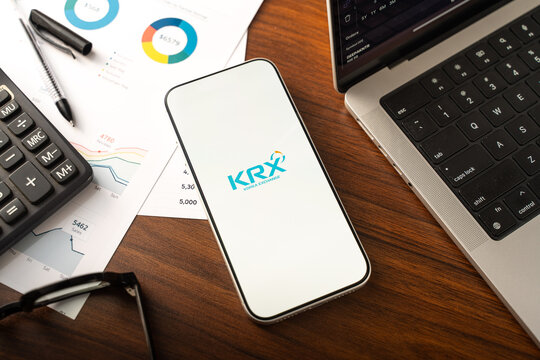 KRX or Korea Exchange logo is displayed on the screen of a smartphone, in Bangalore, India, on February 12, 2026