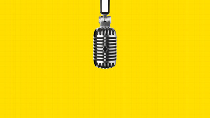 Podcast microphone hangs in front of bright yellow background for recording audio content