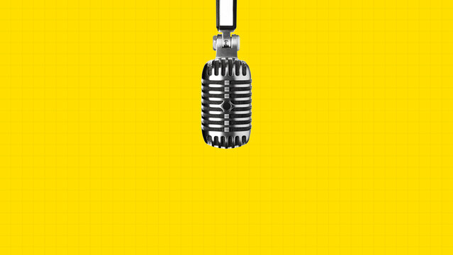 Podcast microphone hangs in front of bright yellow background for recording audio content