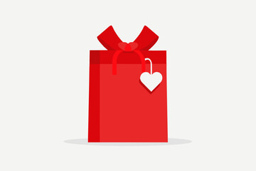 A red gift box with a heart shaped tag