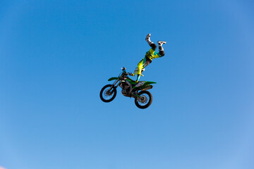 Extreme freestyle motocross jump high in the sky