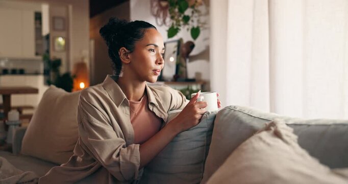 Thinking, sofa and woman with coffee for drink, reflection and wellness in morning. Home, living room and person with beverage, comfort and tea for peace and relax or resting for weekend break