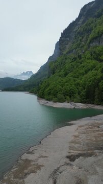 Lake Kl&ouml;ntalersee Switzerland nature travel destination aerial drone vertical video