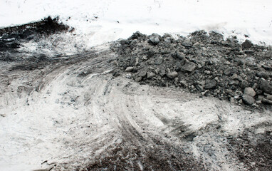 Winter river cleanup site with sludge removal tracks and exposed contamination &mdash; ideal for environmental remediation evidence and municipal reporting.