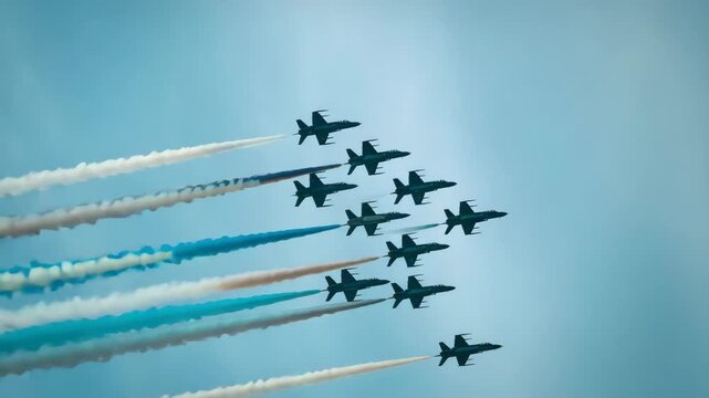 Military jets performing aerobatic stunts with colorful smoke trails