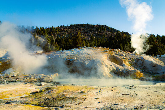 Active fumaroles and a boiling hydrothermal pool steam at Bumpass Hell, Lassen Volcanic National Park, California.