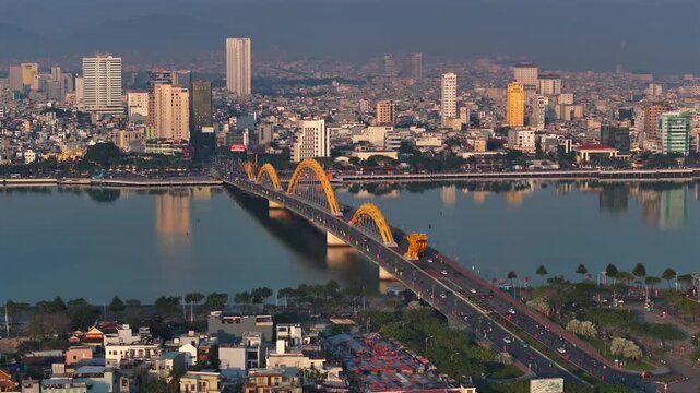 Time Lapse of Traffic across a Dragon Bridge in Da Nang, Aerial. Coastal City of Danang in Vietnam, South East Asia.