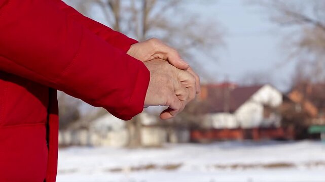 Hands of a man without gloves in winter.A man forgot to put on gloves when going outside on a frosty day.