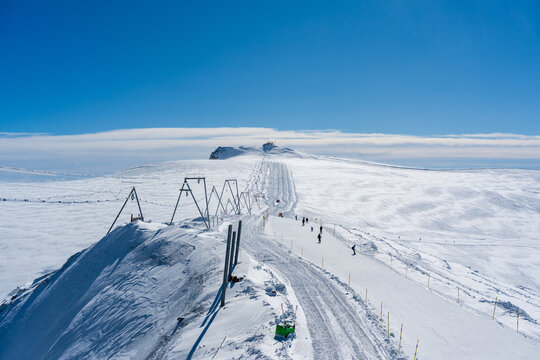 Gobba di Rollin ski lift crossing a vast snowy plateau near the italian border. Zermatt, Canton of Valais, Switzerland. 