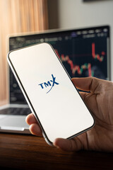 Fototapeta premium TMX Group logo is displayed on the screen of a smartphone, in Bangalore, India, on February 12, 2026