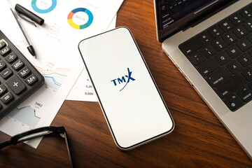 Fototapeta premium TMX Group logo is displayed on the screen of a smartphone, in Bangalore, India, on February 12, 2026