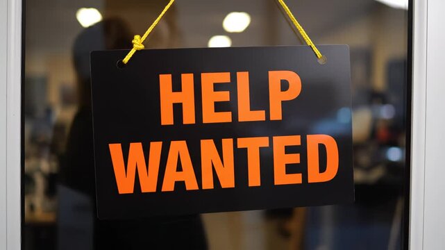 Help wanted sign on glass door